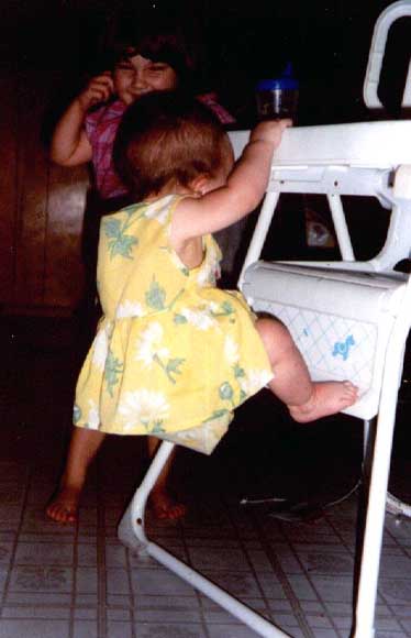 Listi climbing up highchair
